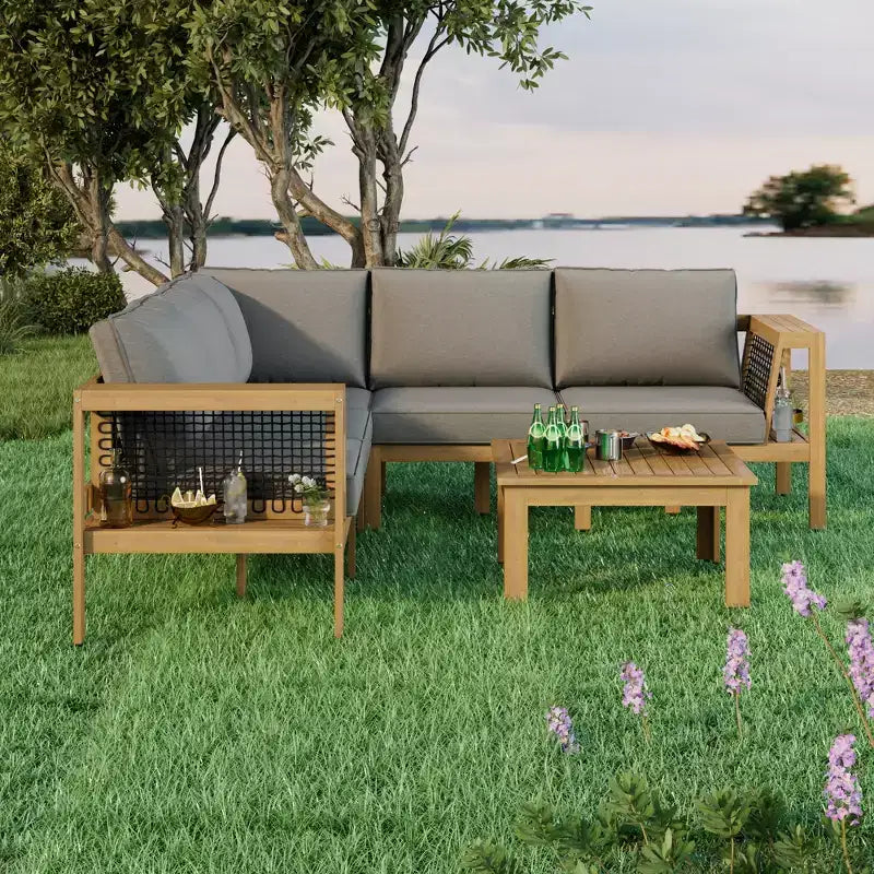 Ensemble de canapés de jardin 4 pièces en bois d'acacia Merax avec table basse et pieds réglables
