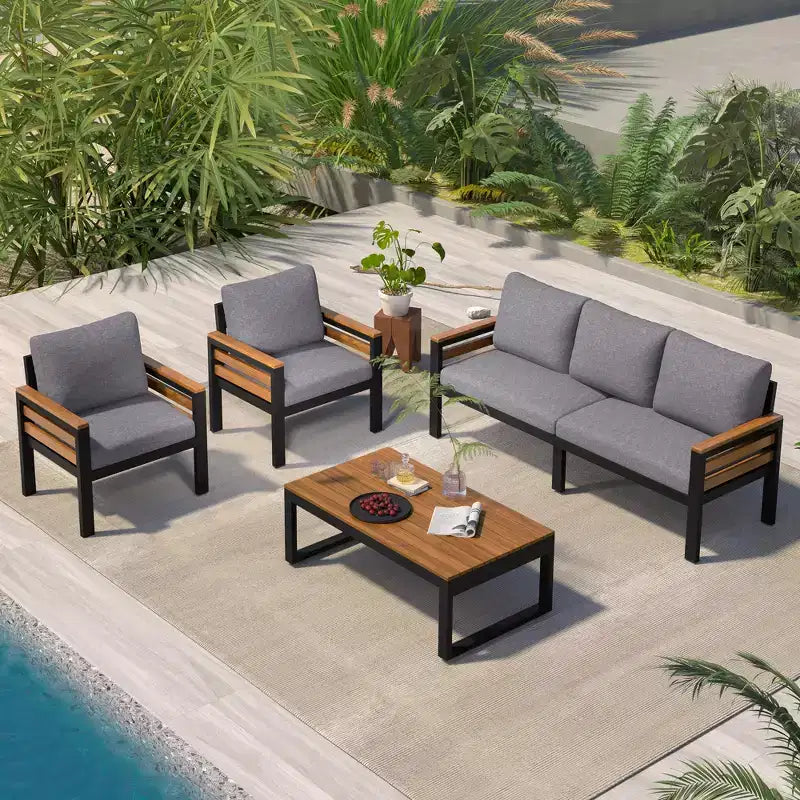 Ensemble de salon de jardin GDFStudio Carter moderne en métal et bois d'acacia 4 pièces avec canapé, table basse et coussins