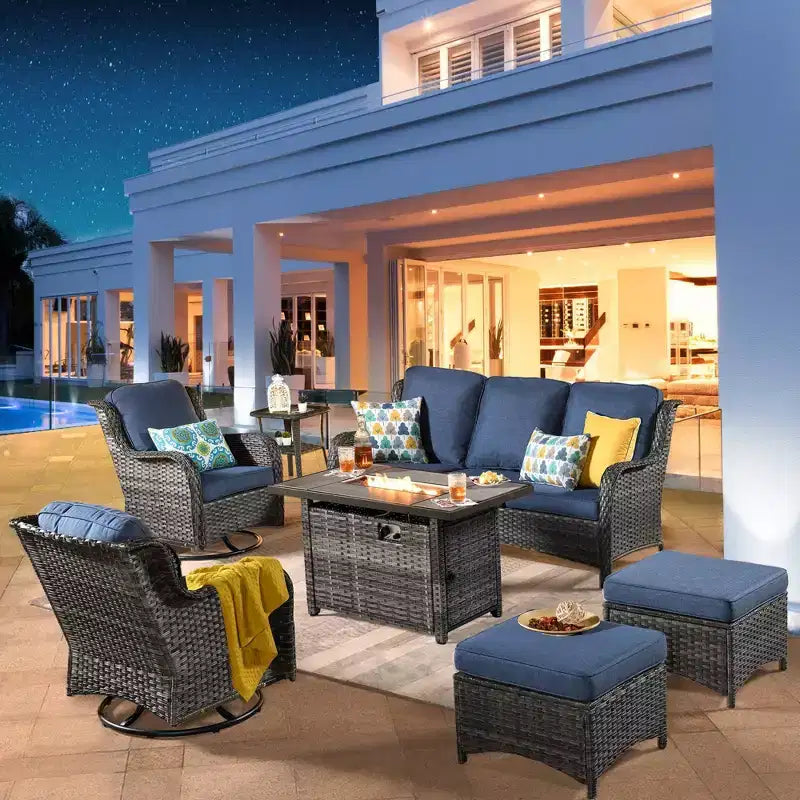 Ensemble de conversation de 7 meubles de patio Ovios Orlando en osier marron avec foyer rectangulaire, fauteuils pivotants et coussins