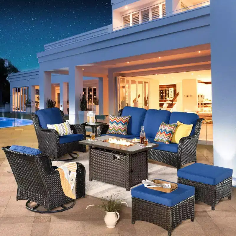 Ensemble de conversation de 7 meubles de patio Ovios Orlando en osier marron avec foyer rectangulaire, fauteuils pivotants et coussins